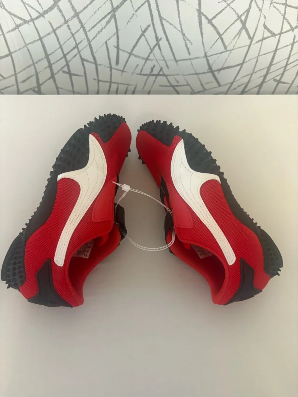 PUMA Mostro OG Sneakers. Vibrant  Red with a Unique Spike Sole.